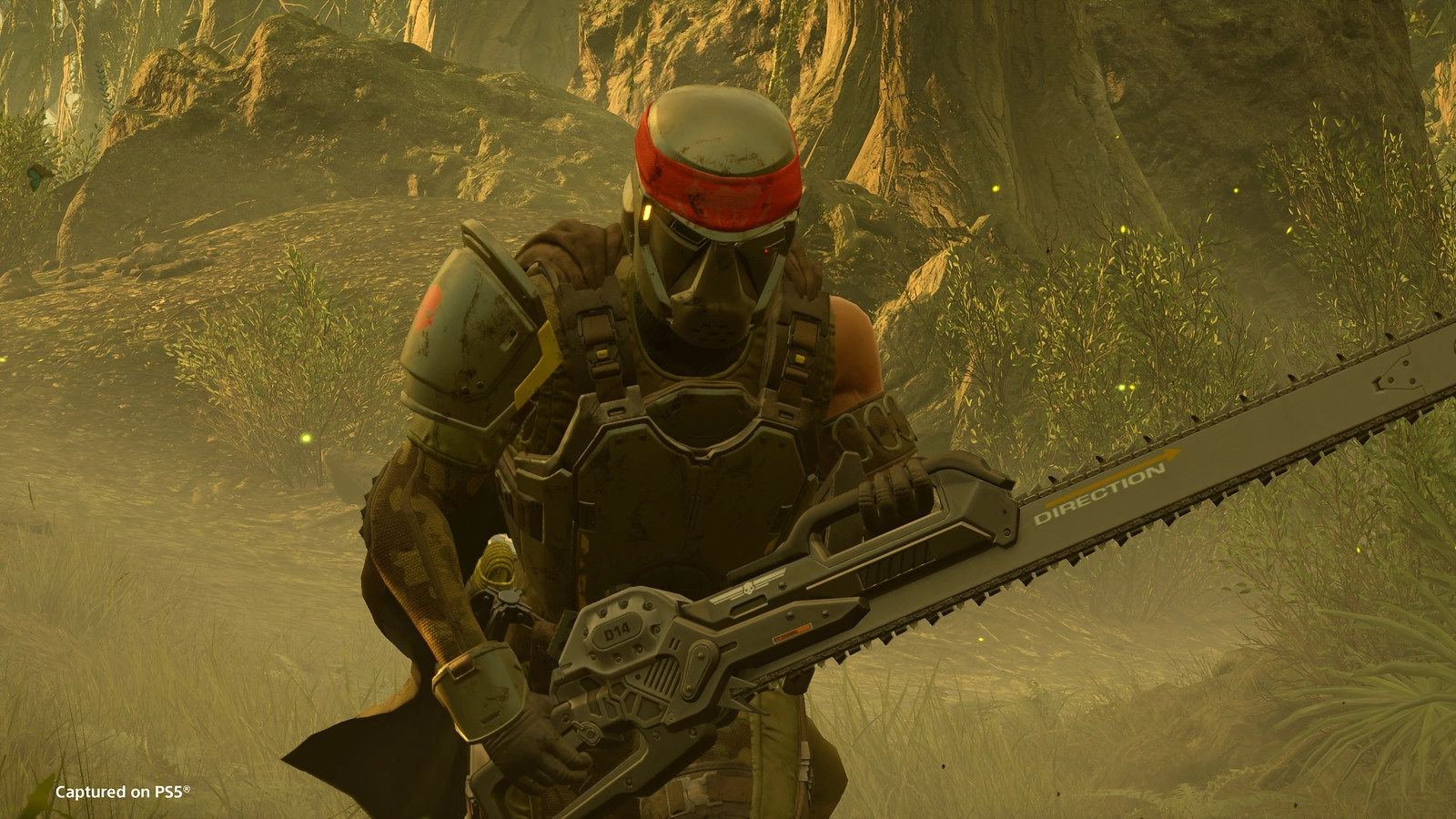 A Helldiver in tactical armor wields a chainsaw in a jungle setting, preparing for intense combat with new gear.