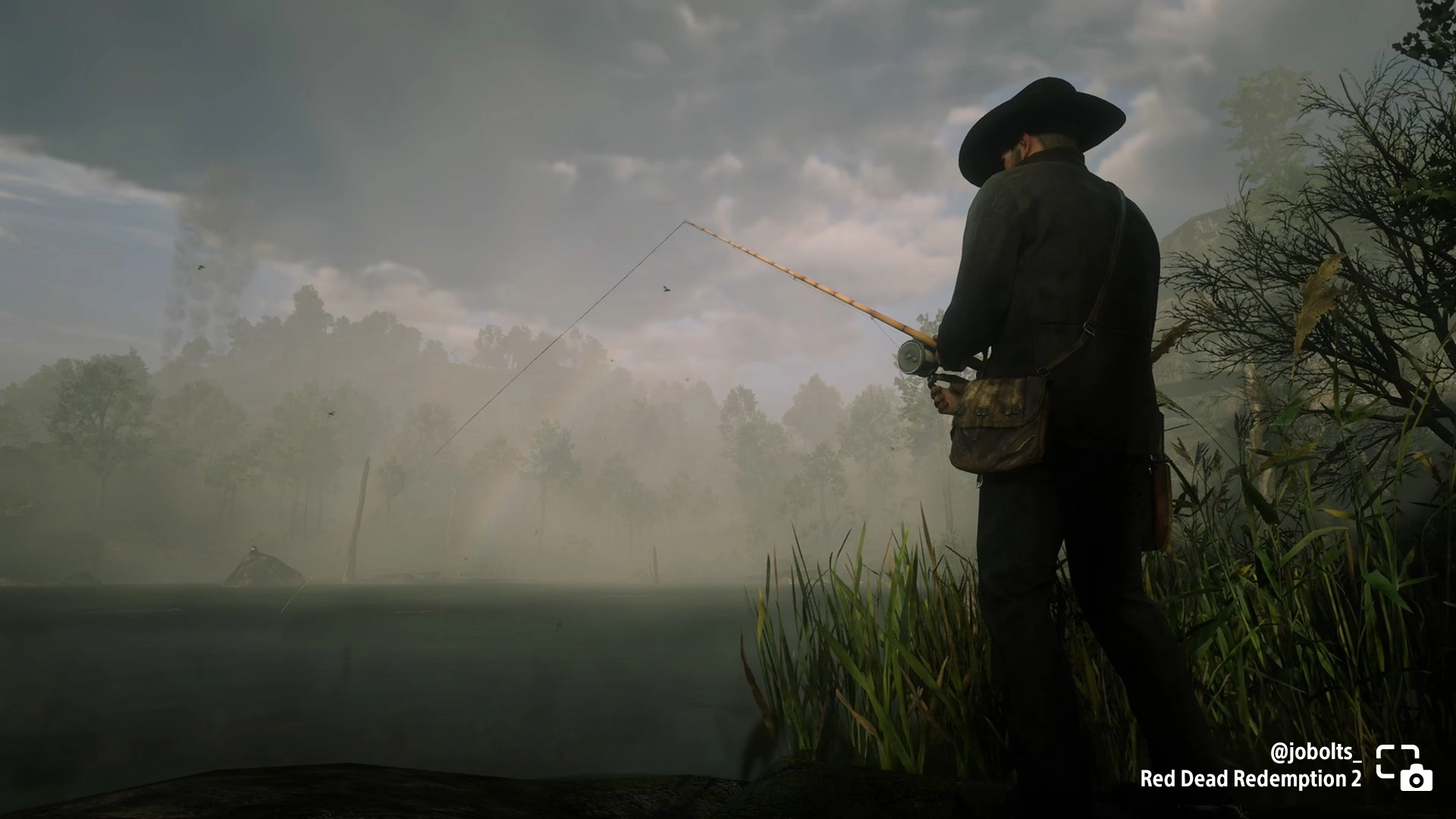 A player fishing in a misty landscape in Red Dead Redemption 2, showcasing tranquil side quest moments. #PSshare #PSBlog