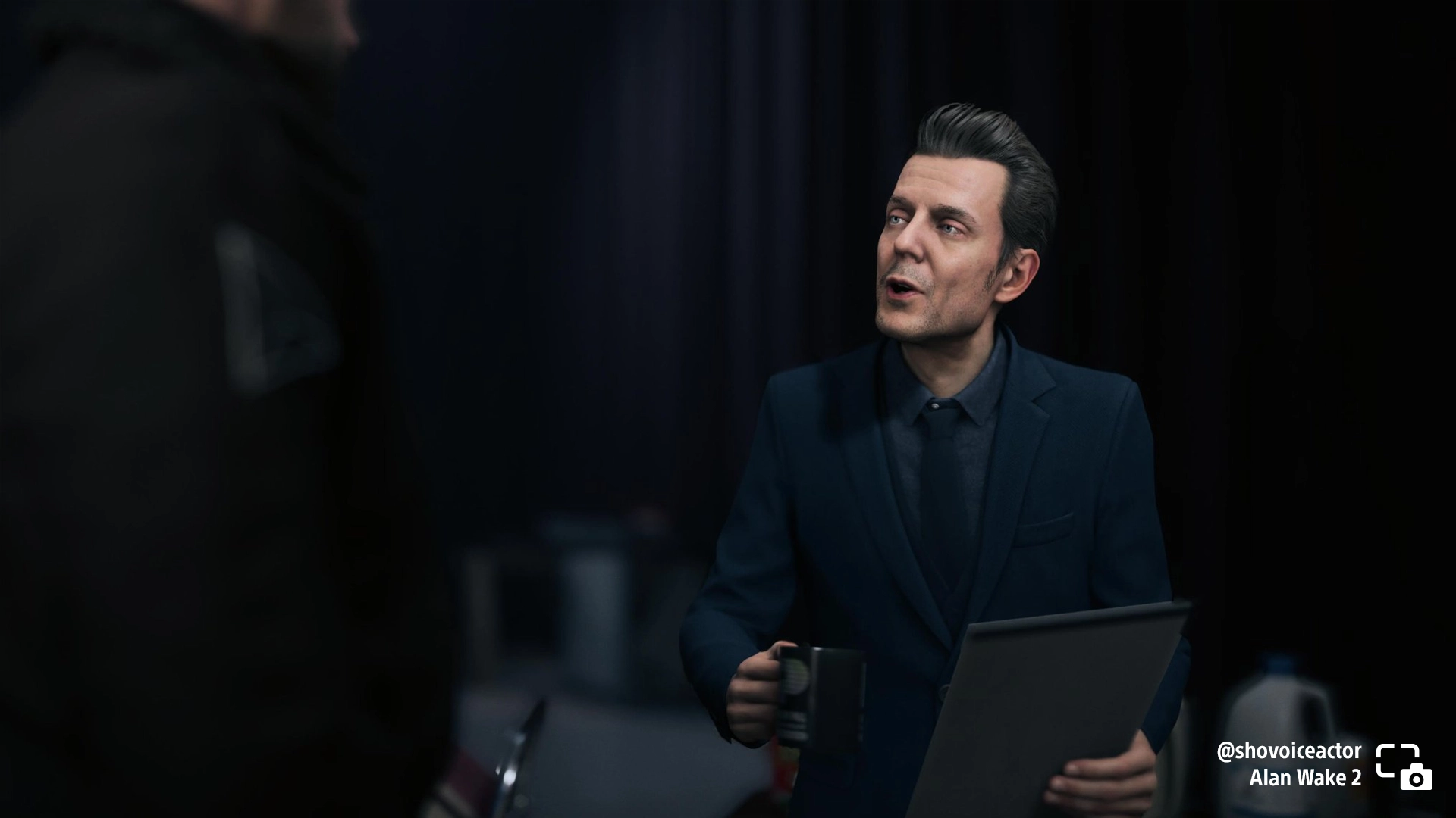 Character Alex Casey from Alan Wake 2 engages in conversation, showcasing an intriguing moment in the game