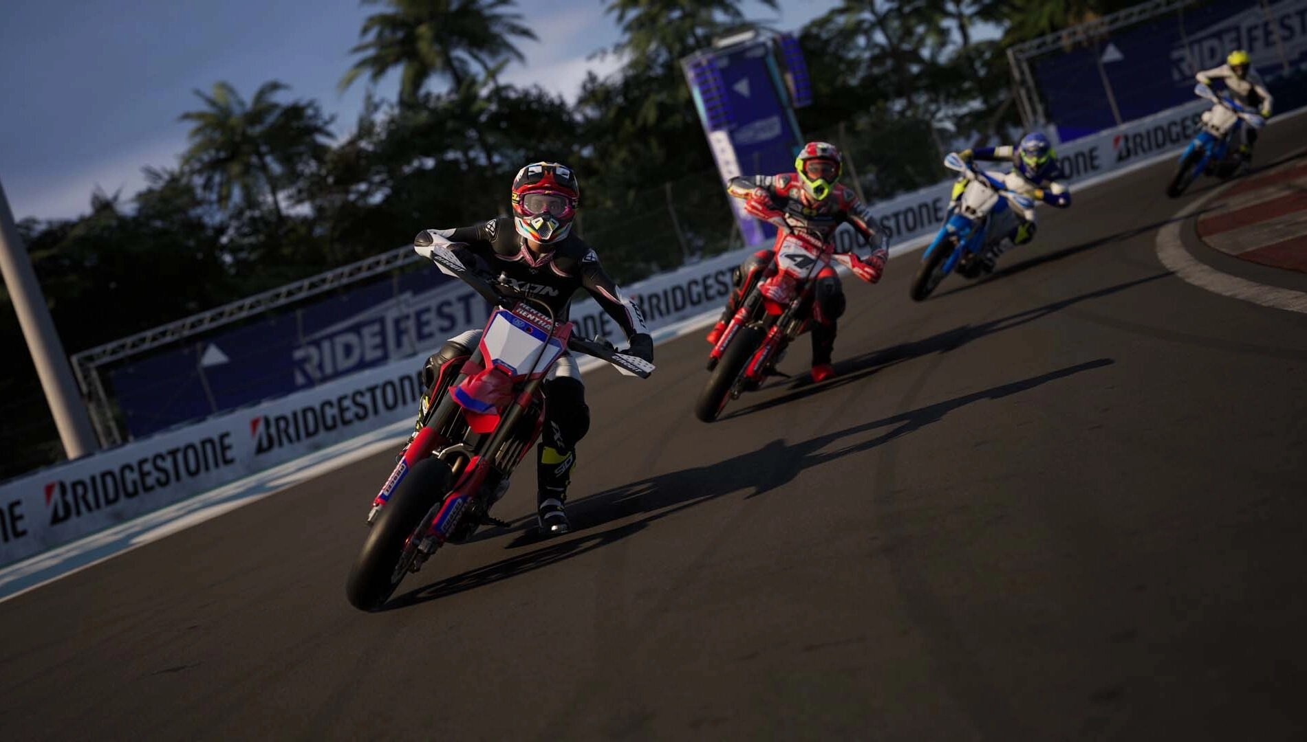 Four riders race on vibrant motorbikes at Ride 6, showcasing the game’s detailed bike designs and dynamic gameplay.