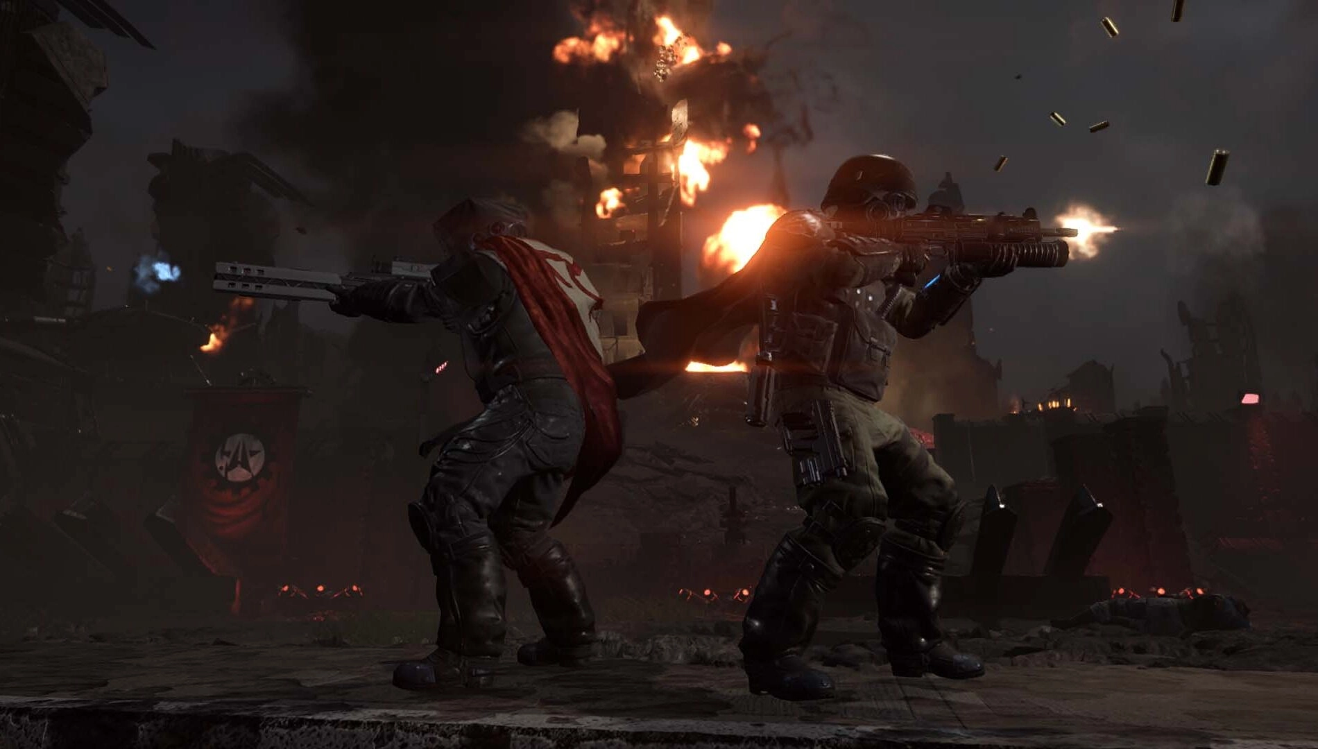 Two armed soldiers in battle gear face forward amidst explosions, showcasing Helldivers 2 x Killzone epic intergalactic wa...