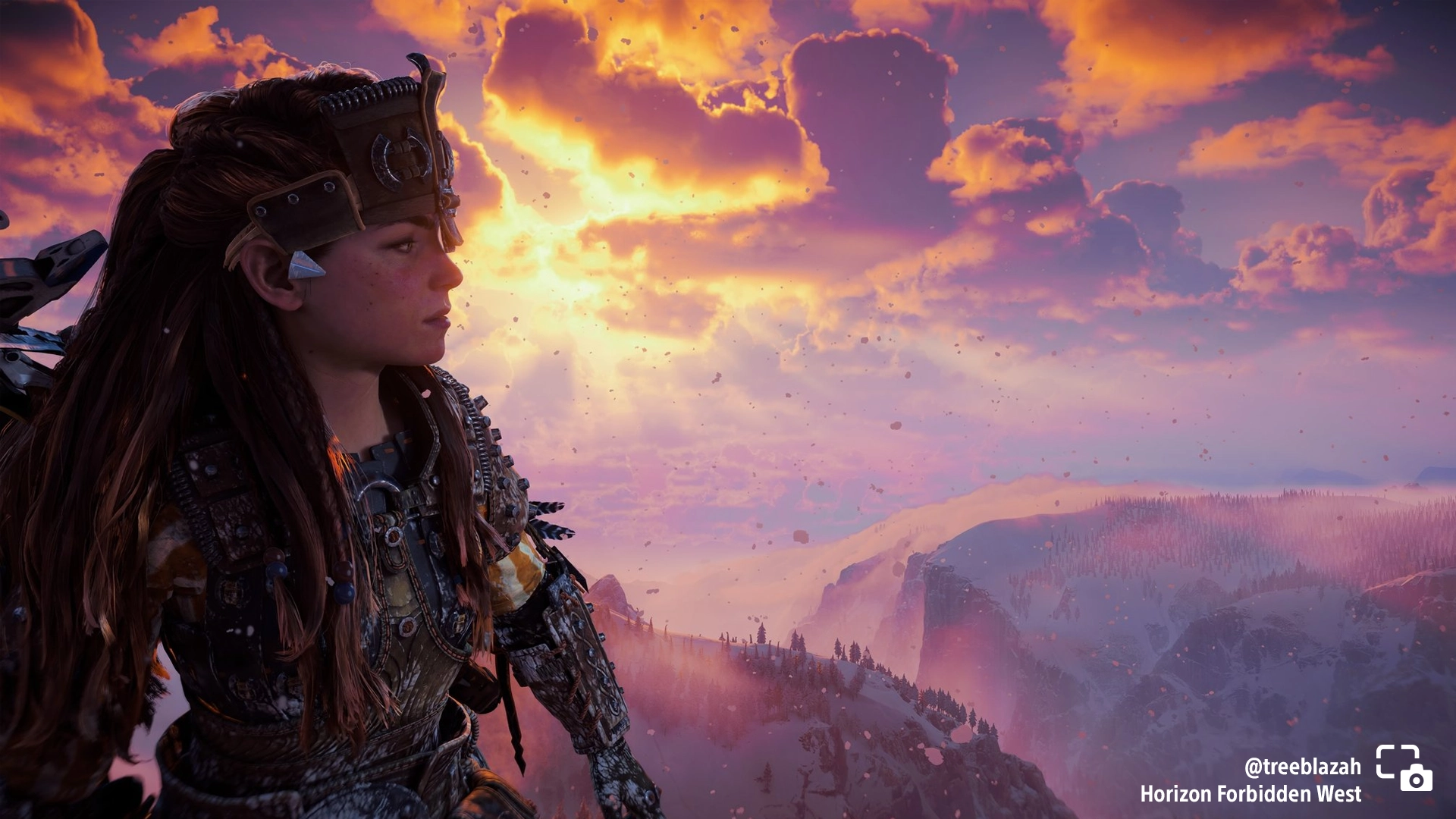 Aloy gazes over a stunning snowy vista at sunset in Horizon Forbidden West. #PSshare #PSBlog