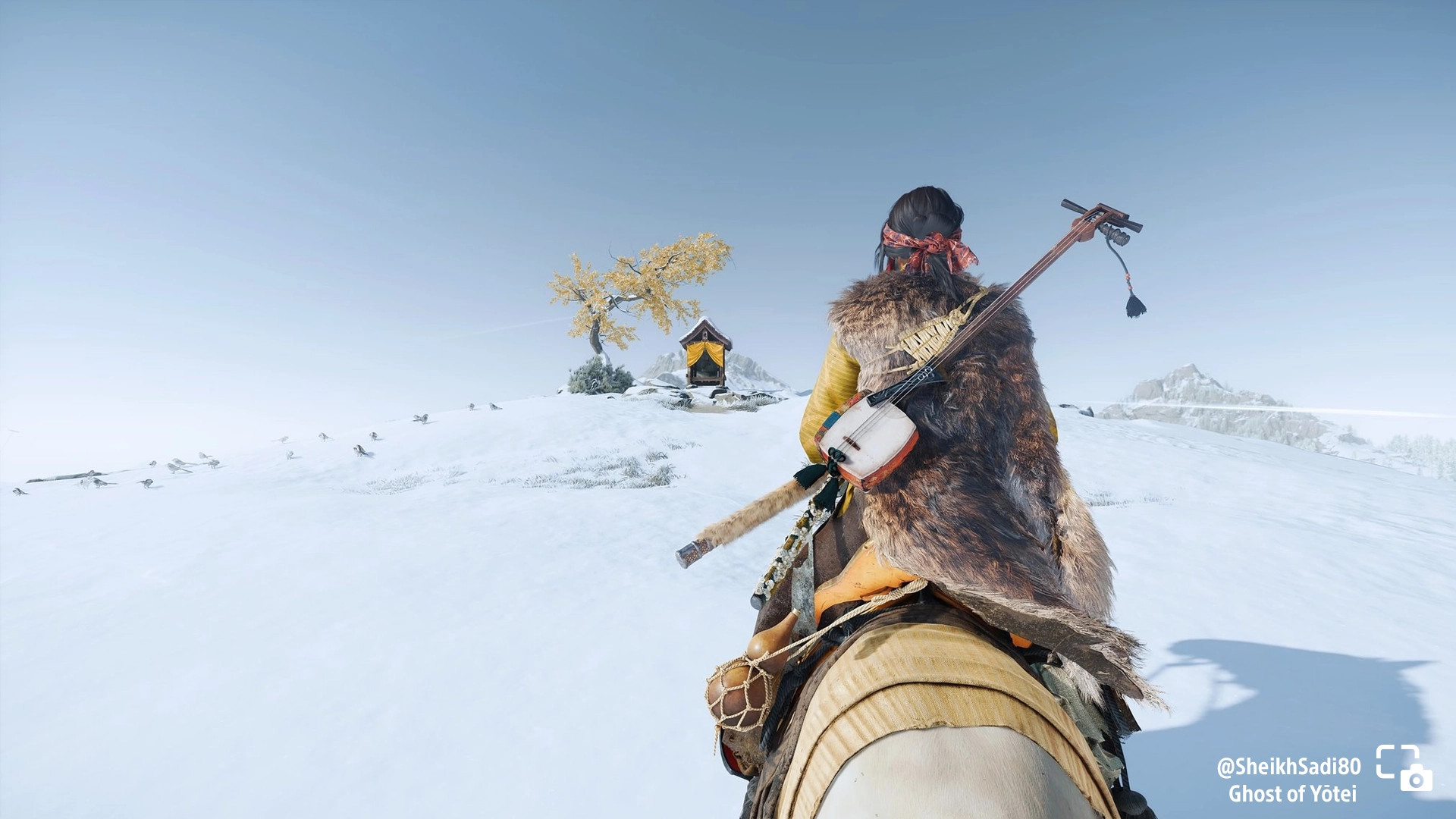 Atsu rides to a shrine atop a snowy hill in Ghost of Yōtei, part of this week