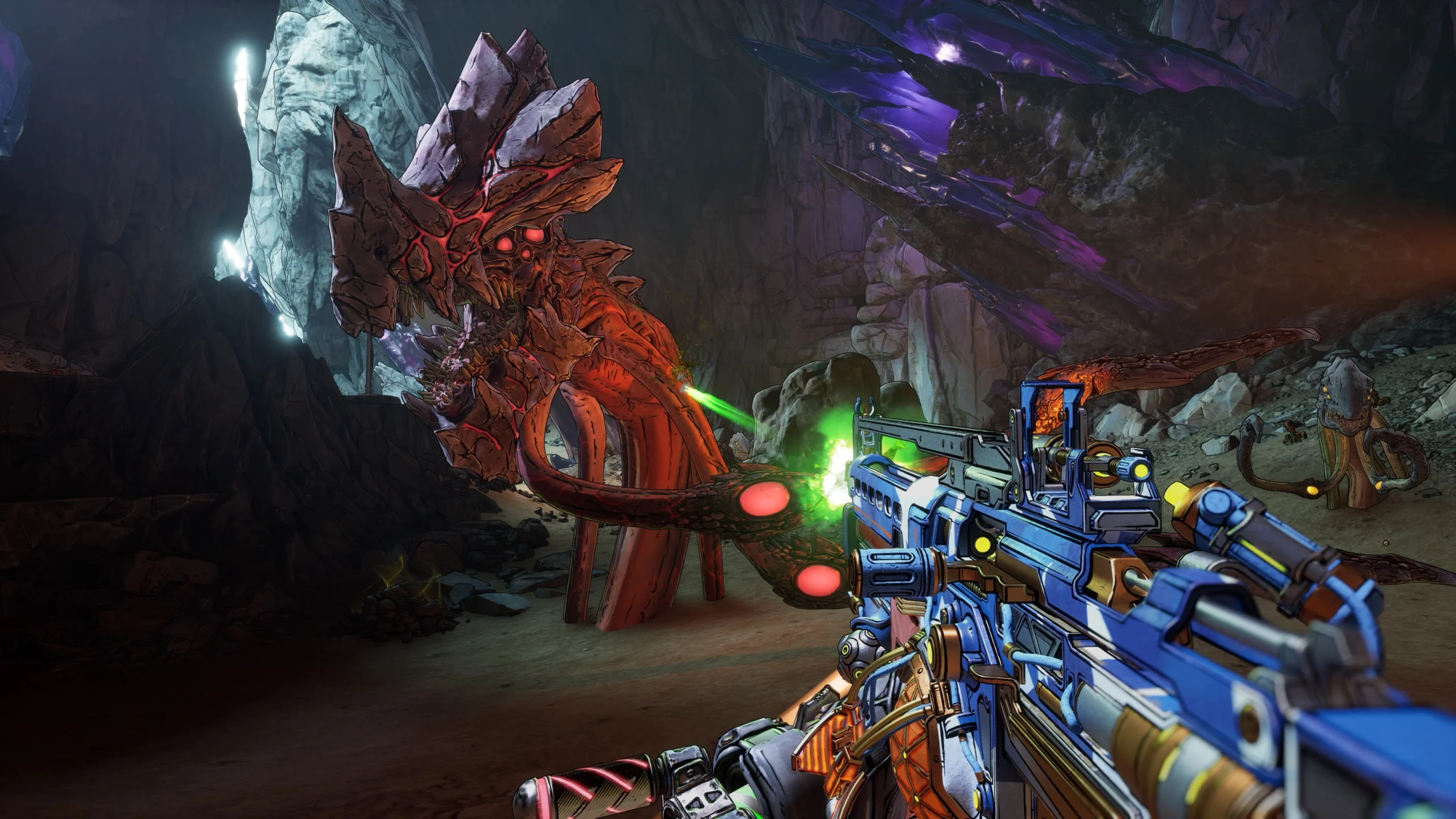 A Vault Hunter aims a futuristic weapon at a menacing alien creature in a vibrant cave setting