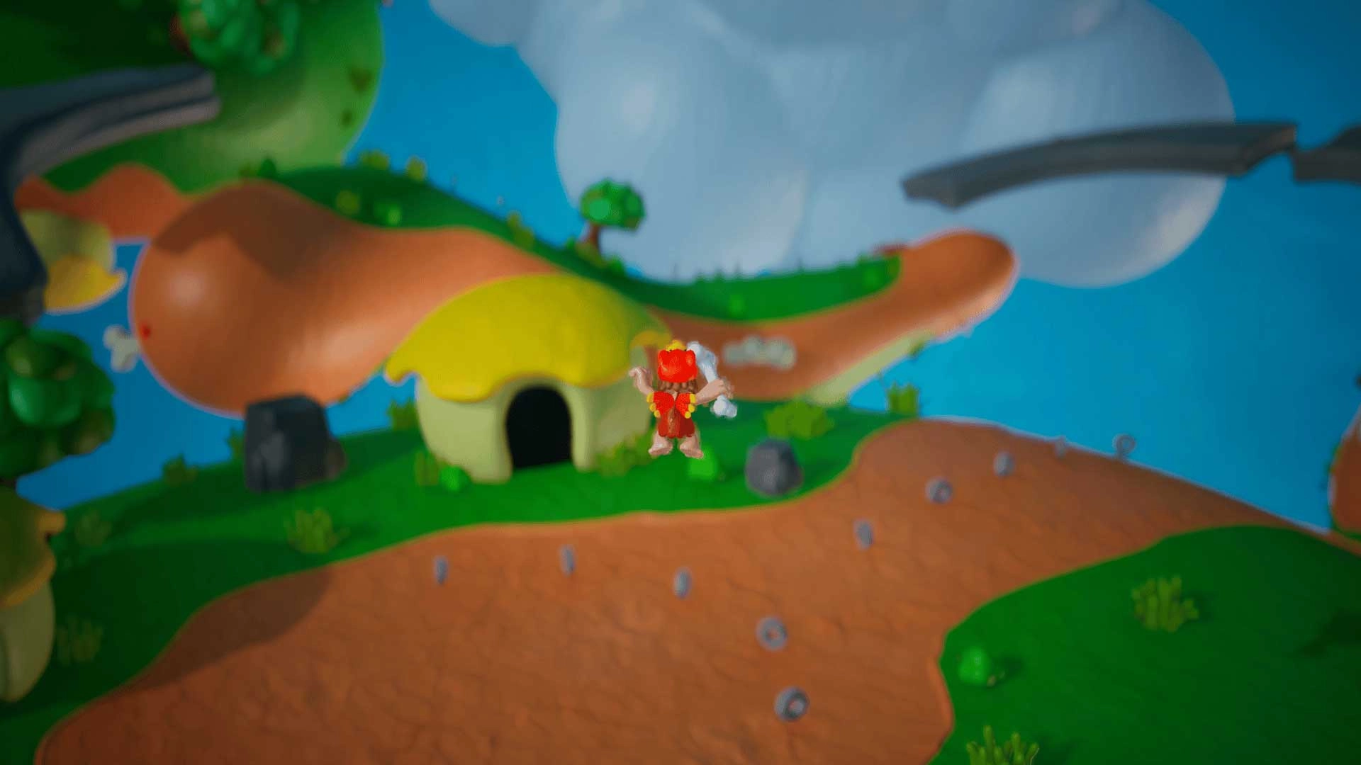 Caveman character exploring colorful, play-dough planet with multi-gravity environment and cave entrance