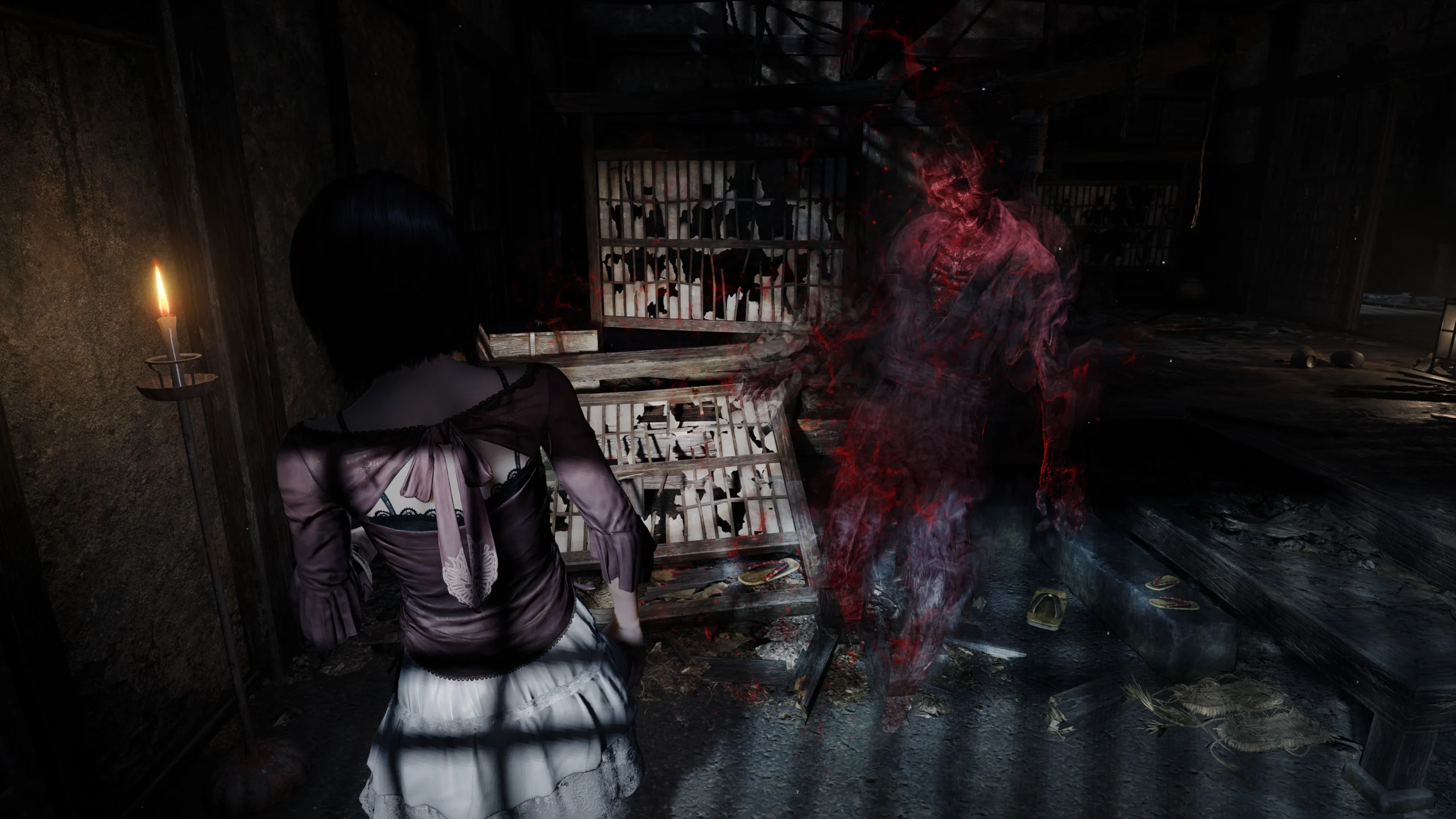 A character confronts a ghostly figure in a dimly lit room, enhancing the eerie atmosphere of Fatal Frame II remake