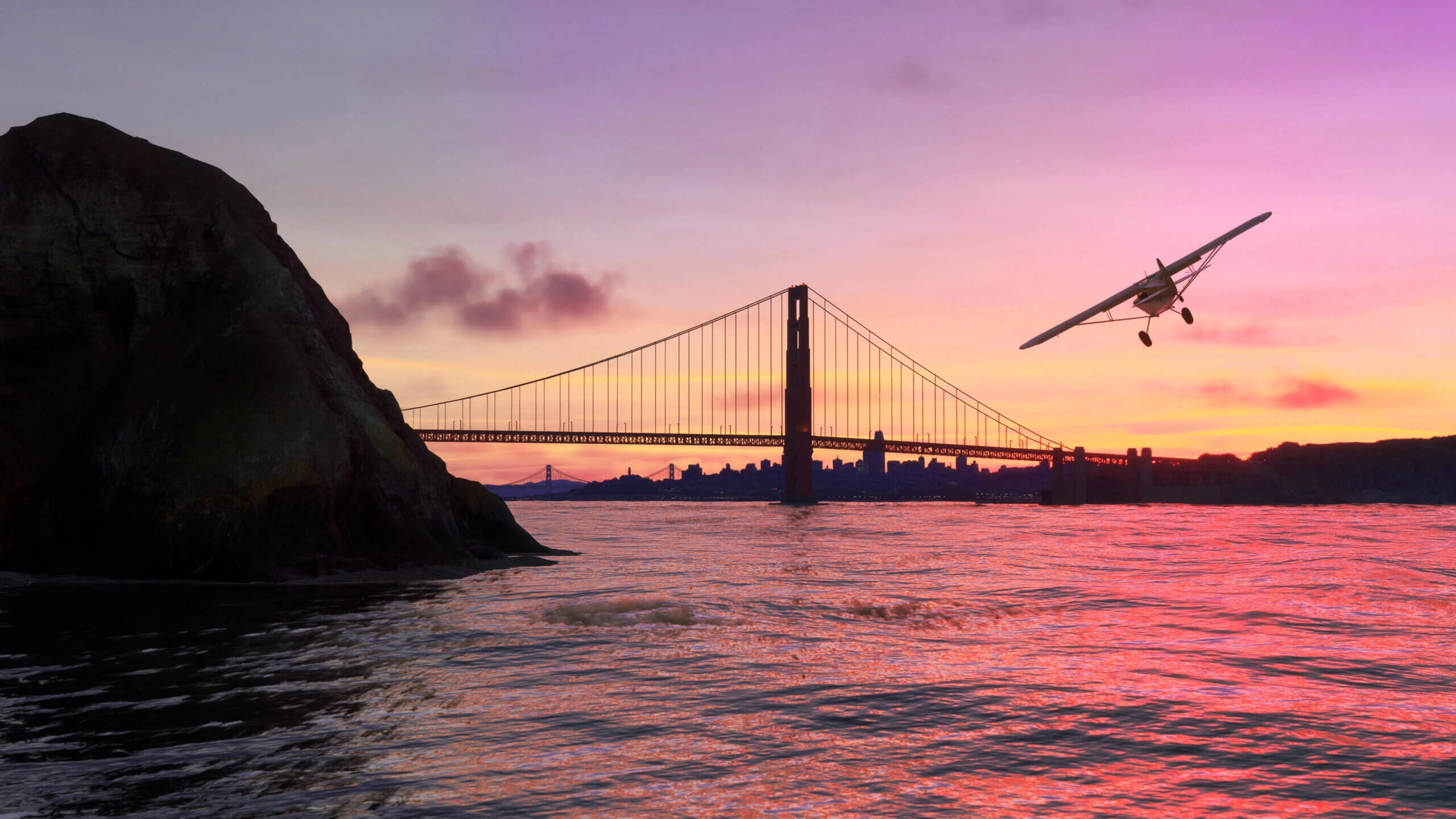 A small plane flies over the Golden Gate Bridge at sunset, showcasing California's scenic beauty in Flight Simulator