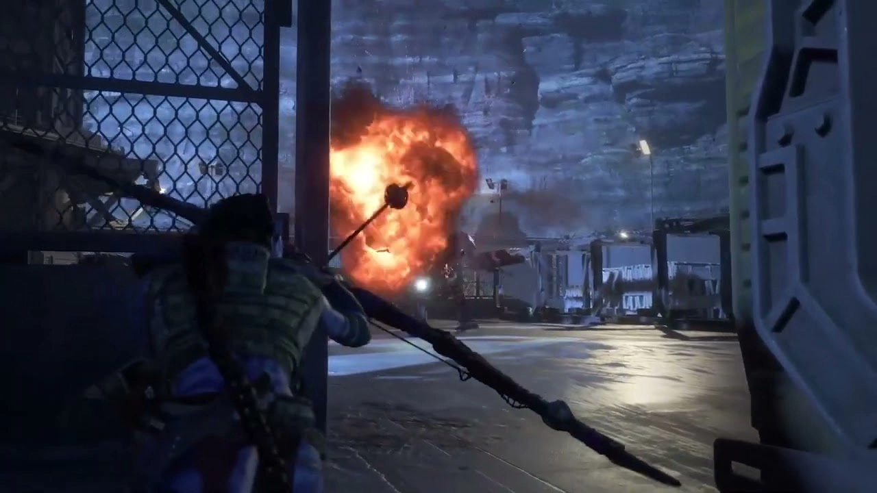 A character with a bow crouches as an explosion occurs in a futuristic setting on Pandora's Western Frontier