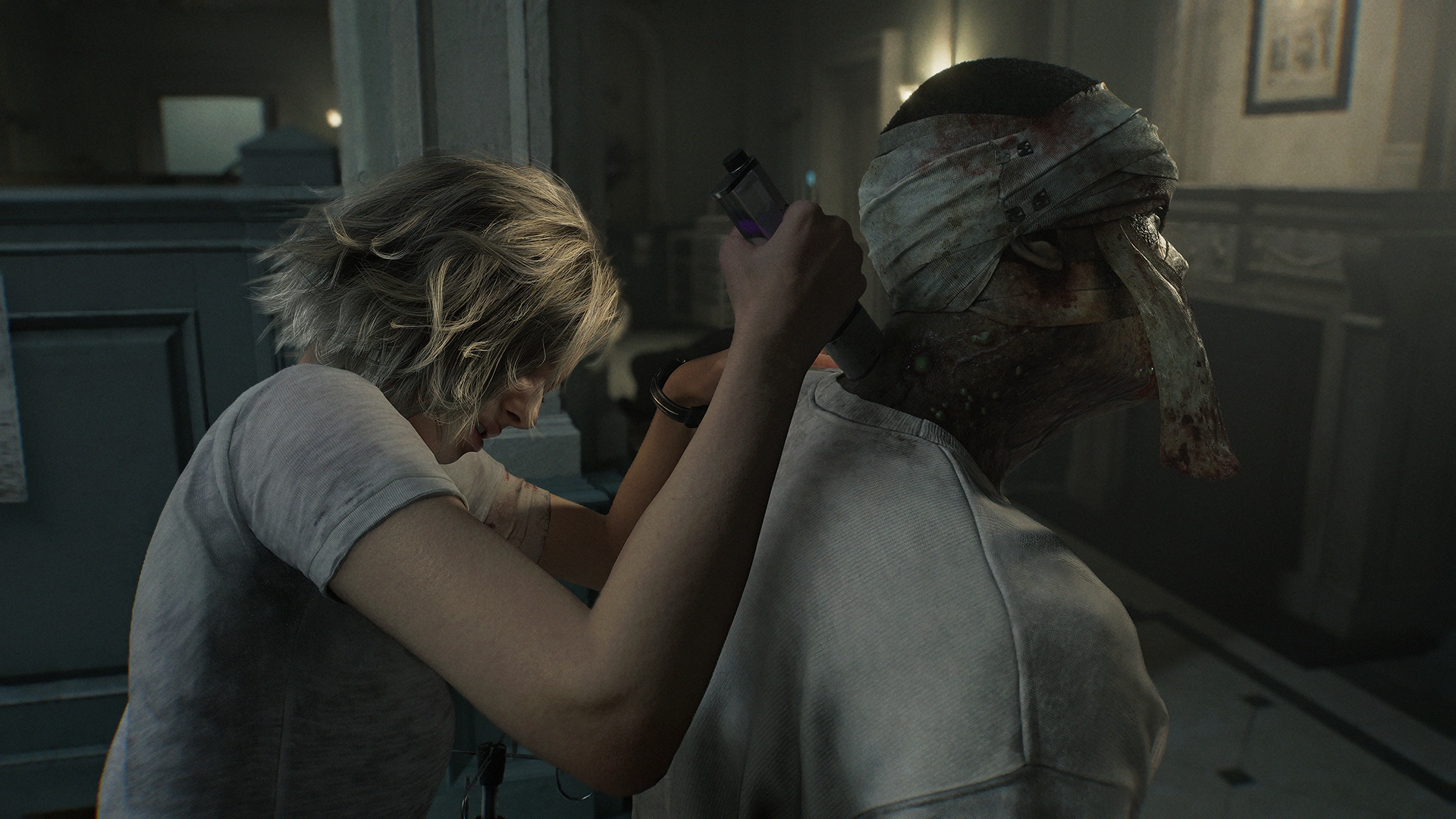 A woman cautiously approaches a restrained zombie in a dimly lit room, setting a tense atmosphere
