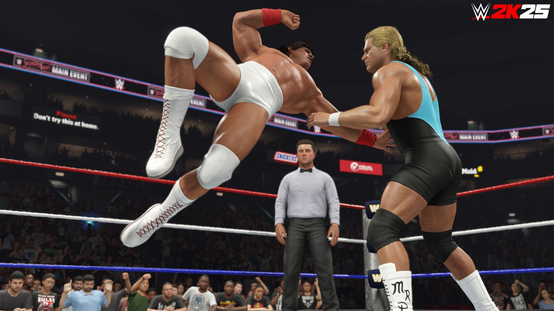 Wrestlers in action in WWE 2K25 ring, showcasing a dynamic move with a referee and crowd watching