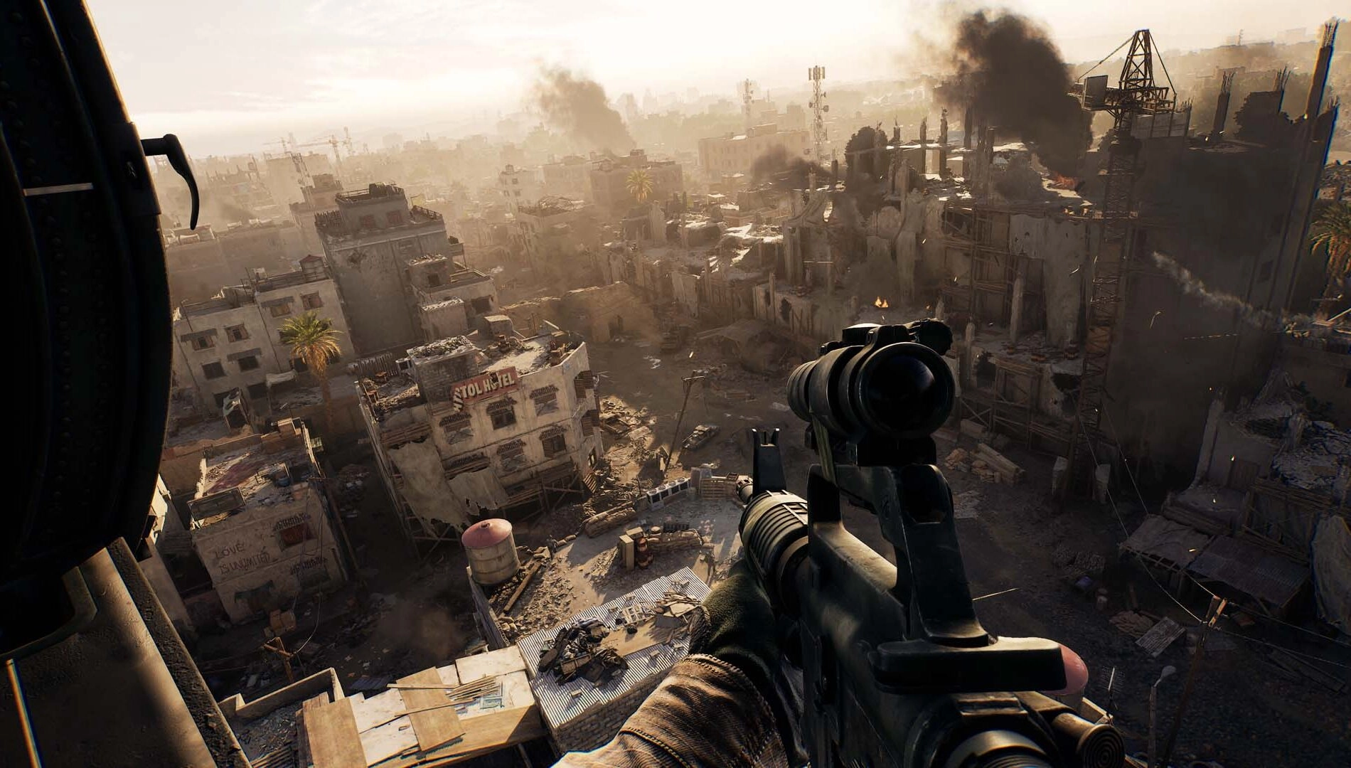A sniper rifle aims over a war-torn cityscape, with smoke rising from damaged buildings in the distance