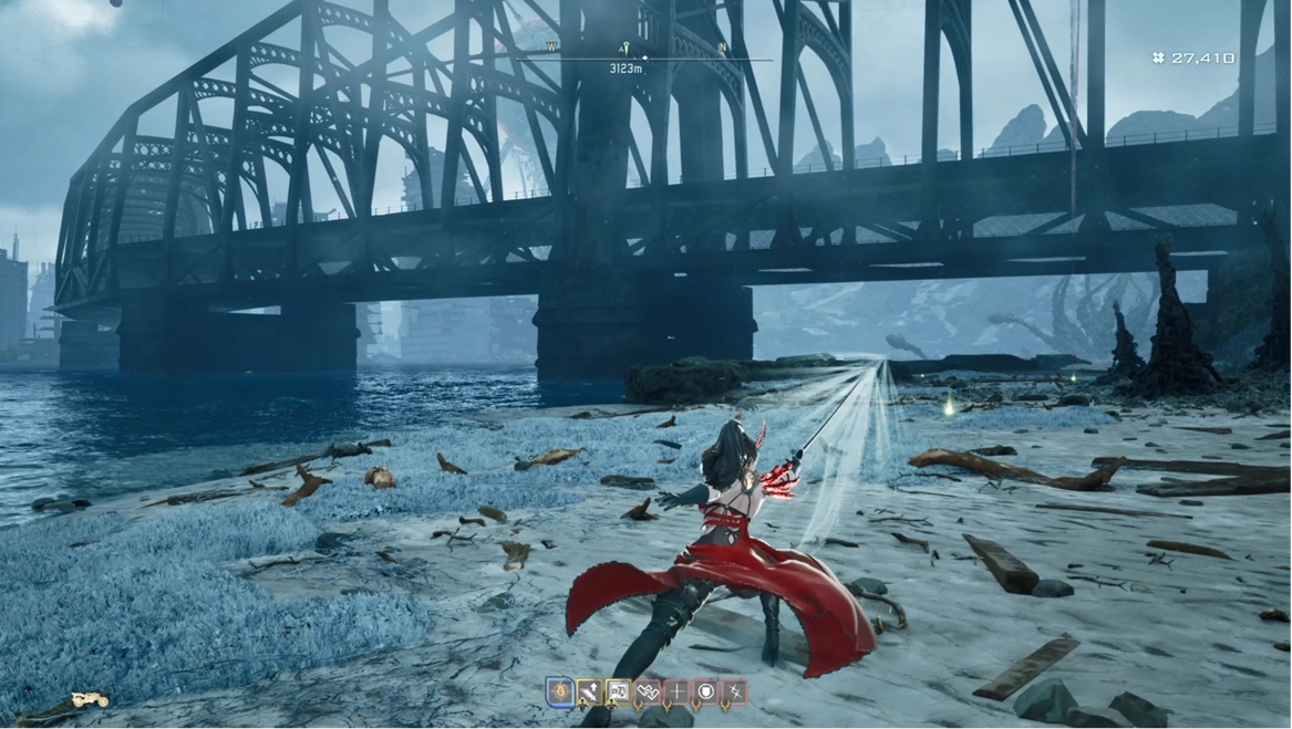 Character in red cloak wielding a sword on a snowy beach, with a large bridge in the background