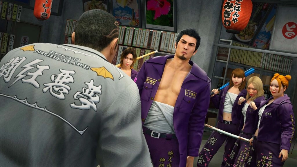 Kiryu confronts a rival gang leader in a tense standoff, surrounded by his allies in a bustling street setting