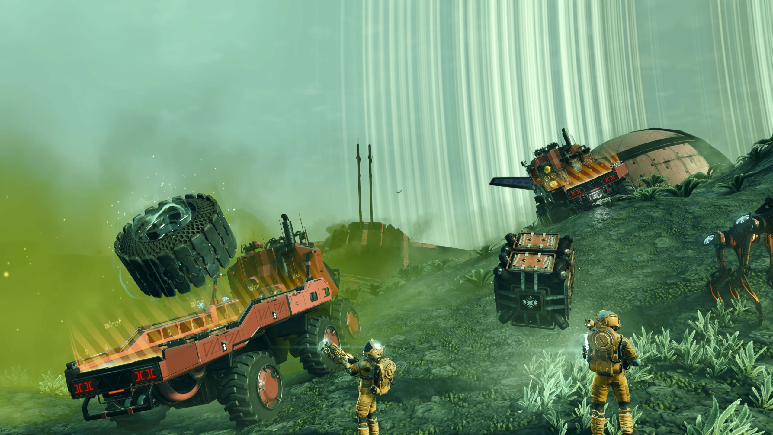 Players using gravity gun to load cargo onto trucks in No Man's Sky's new Remnant update environment