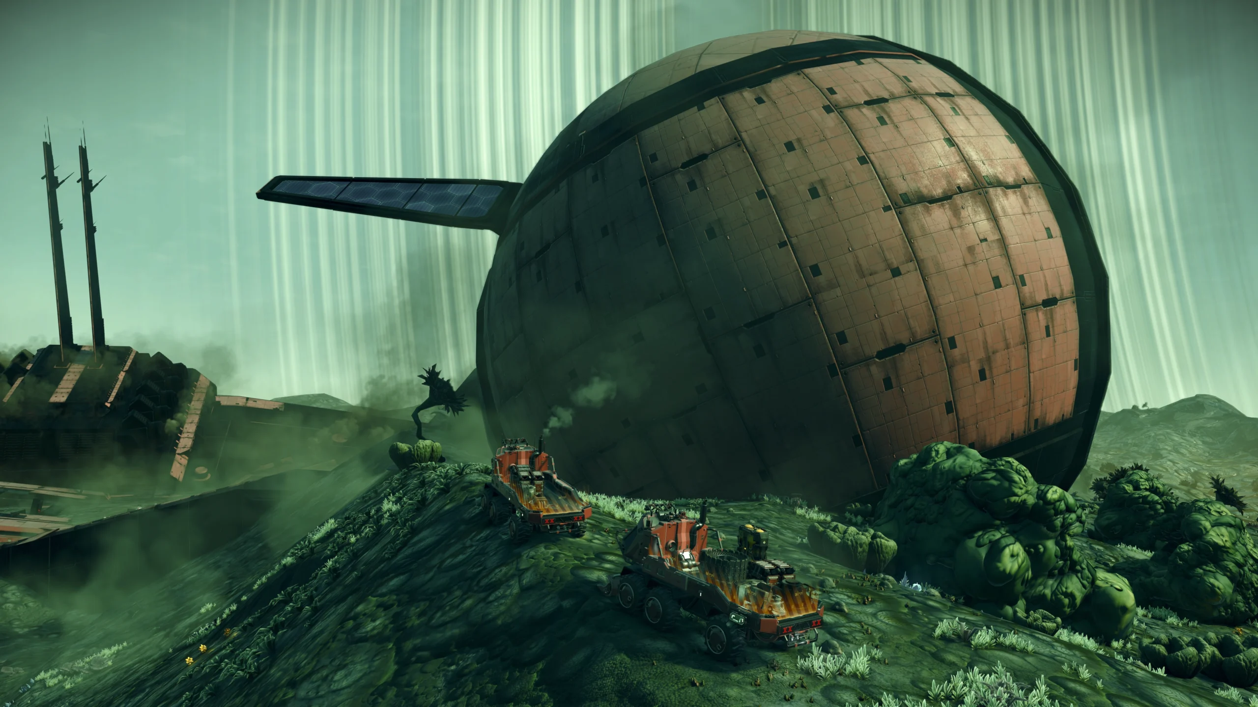 Massive spherical structure on alien terrain with trucks and lush green landscape in No Man's Sky update Remnant