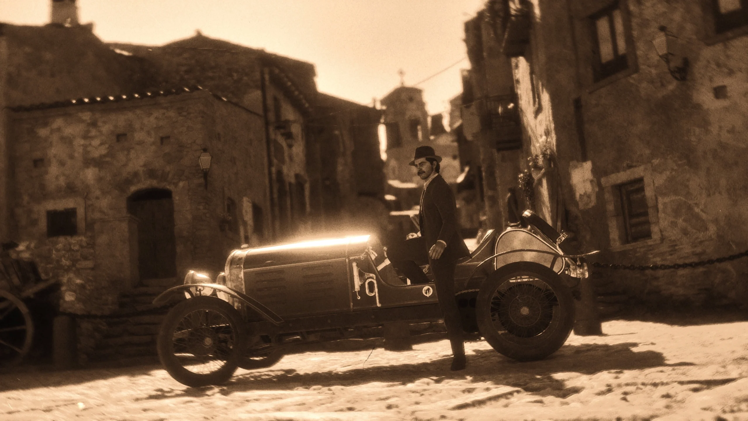 A vintage car parked on a cobblestone street in a historic town, with sepia tones enhancing nostalgia