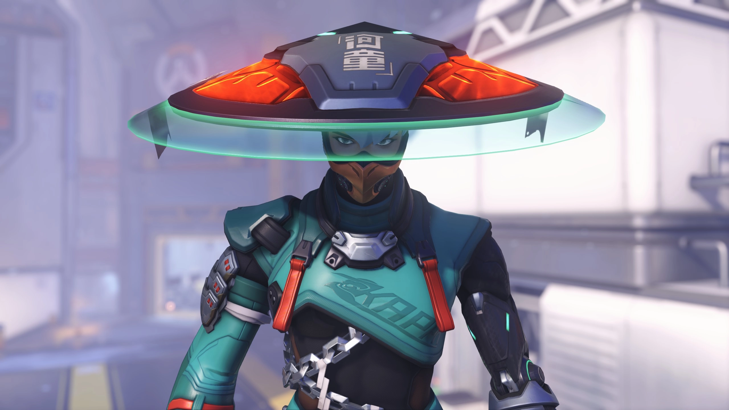 A futuristic character in teal armor with a glowing hat, set in an Overwatch-themed environment